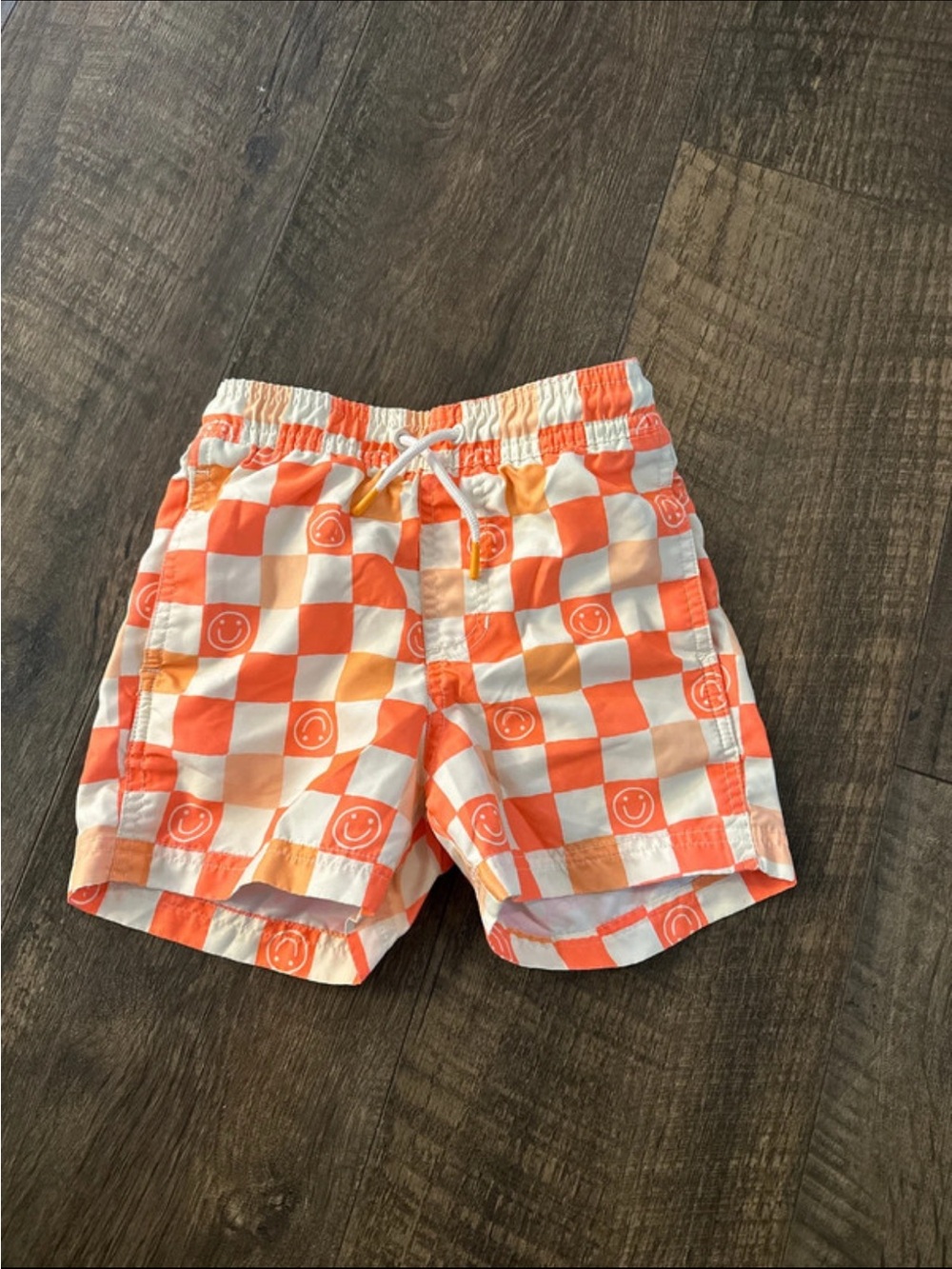 Kids Orange Checkered Swim Shorts with Smiley Print